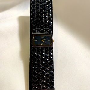 Black/gold circle design band, with simple rectangle watch face